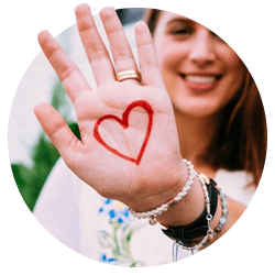 Young girl with heart drawn on left hand